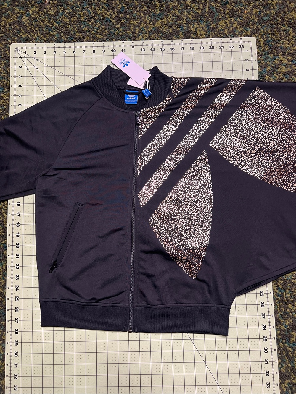 adidas Originals Black Track Jacket with Gold Metallic Print. wing sleeve